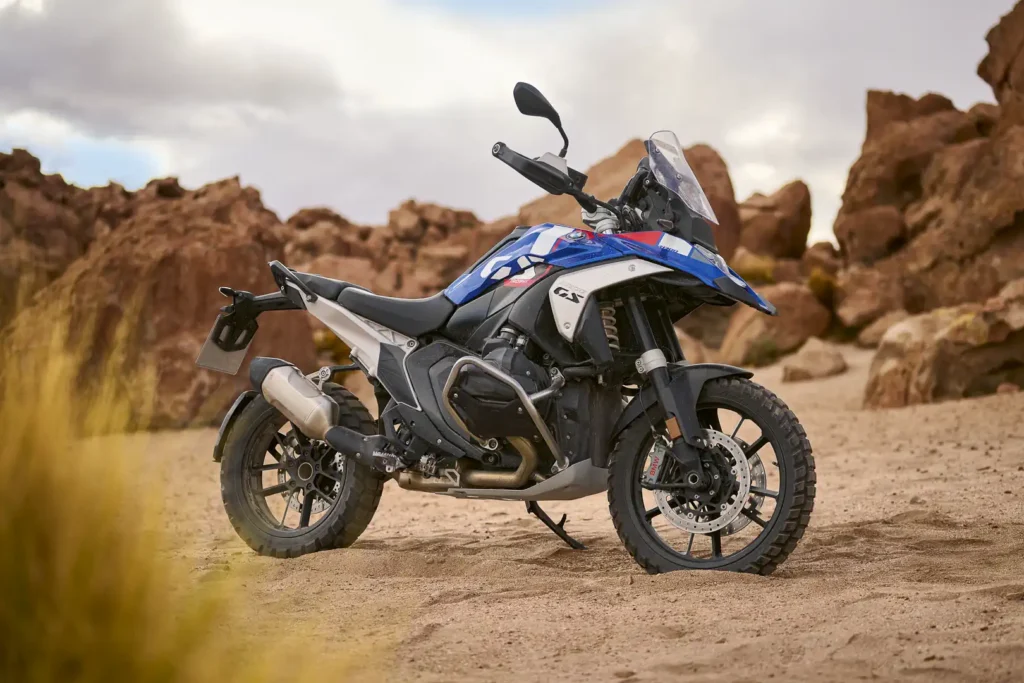 2024 BMW R 1300 GS parked on a desert road with red rock formations