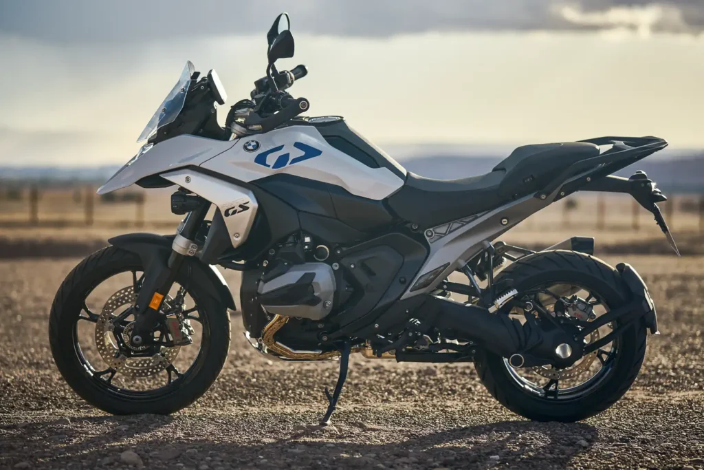 2024 BMW R 1300 GS parked on a dirt plain at dusk