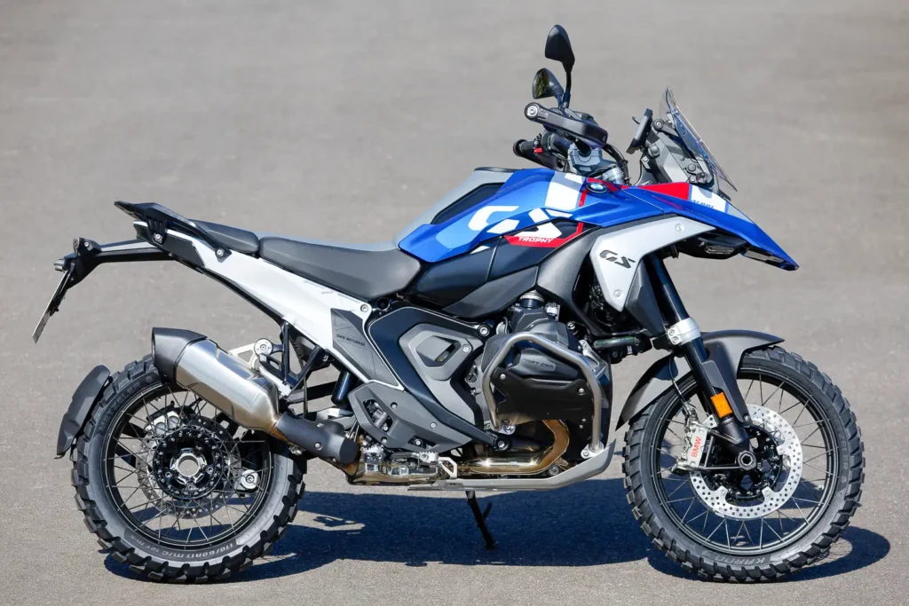 2024 BMW R 1300 GS Trophy in blue and white with wire-spoke wheels, parked