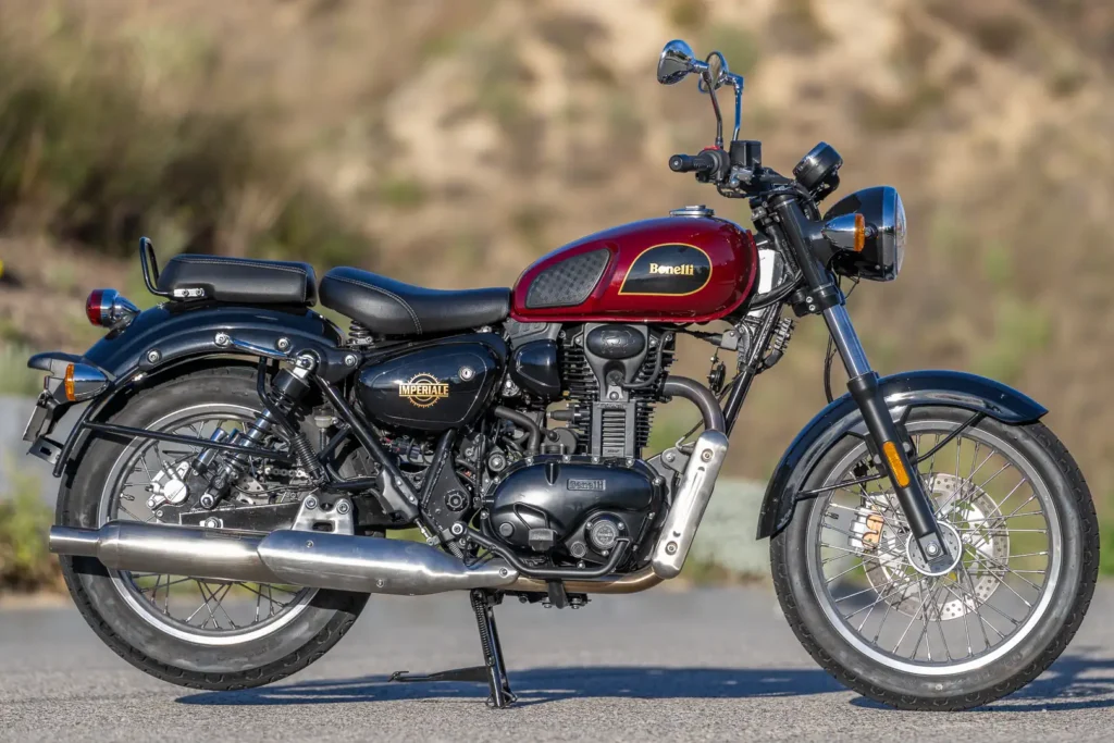 2024 Benelli Imperiale 400 in red and black, parked on a hillside road, left side view