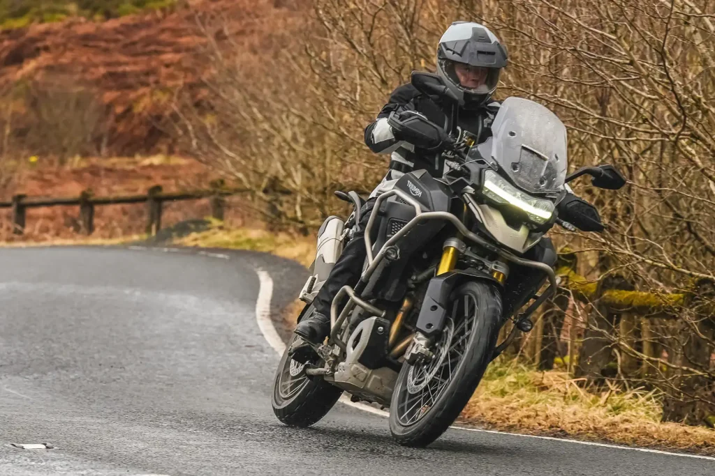 2024 Triumph Tiger 1200 in a turn testing the Xpd X-Venture H2Out boots.
