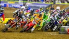 Riders in the first turn at a supercross race.