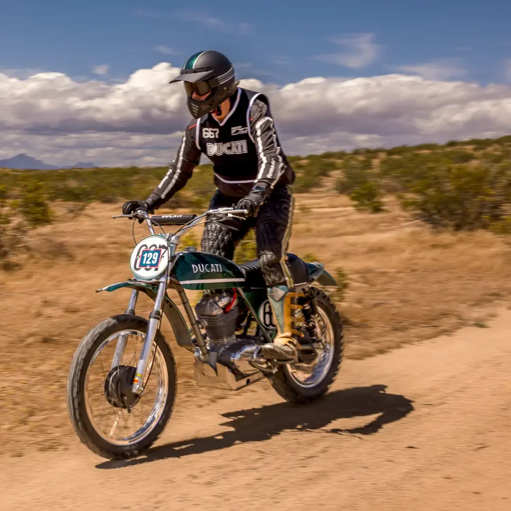 Ducati North America CEO Jason Chinnock on a 1971 Ducati 450 R/T Desmo.