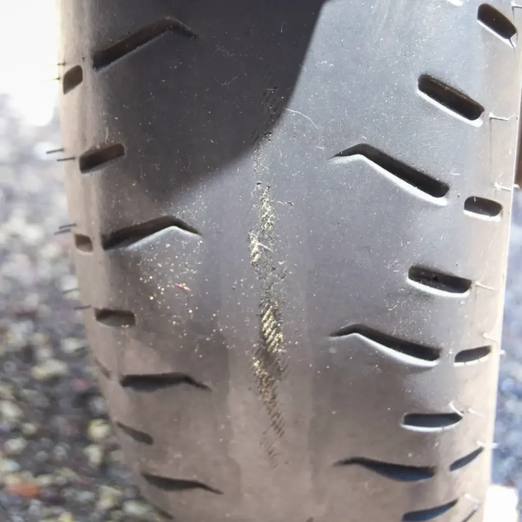 Continental ContiTour Long Term Tire Test. Cord showing through worn tire