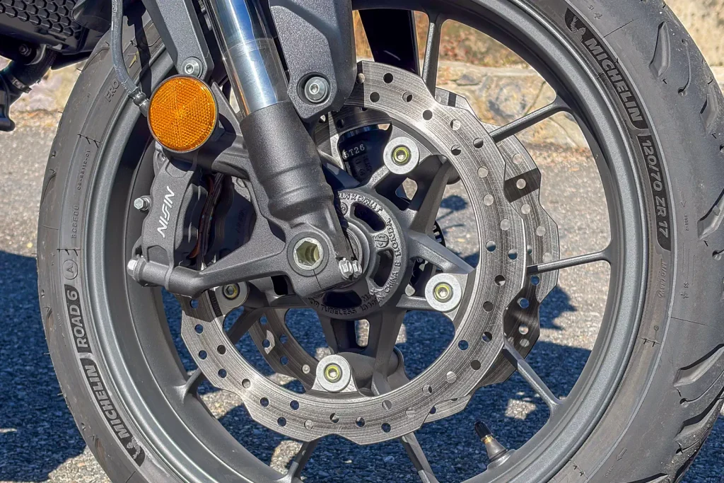 Nissin front brakes on a motorcycle with Michelin Road 6 tires.