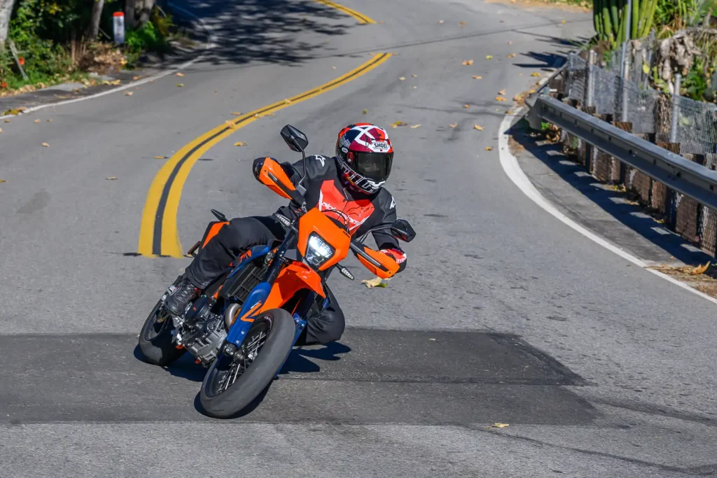 2026 KTM 690 SMC R Review: Nic de Sena running through the esses on the supermoto bike