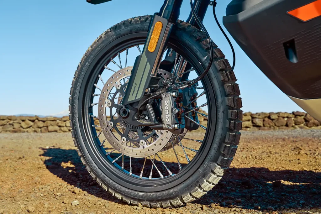 2027 CFMoto Ibex 950 Adventure Bike First Look: Brembo caliper and 21-inch front wheel and Pirelli adventure tire