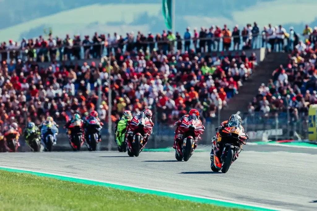 2027 MotoGP Calendar: Pedro Acosta leading the field at the start of a race.