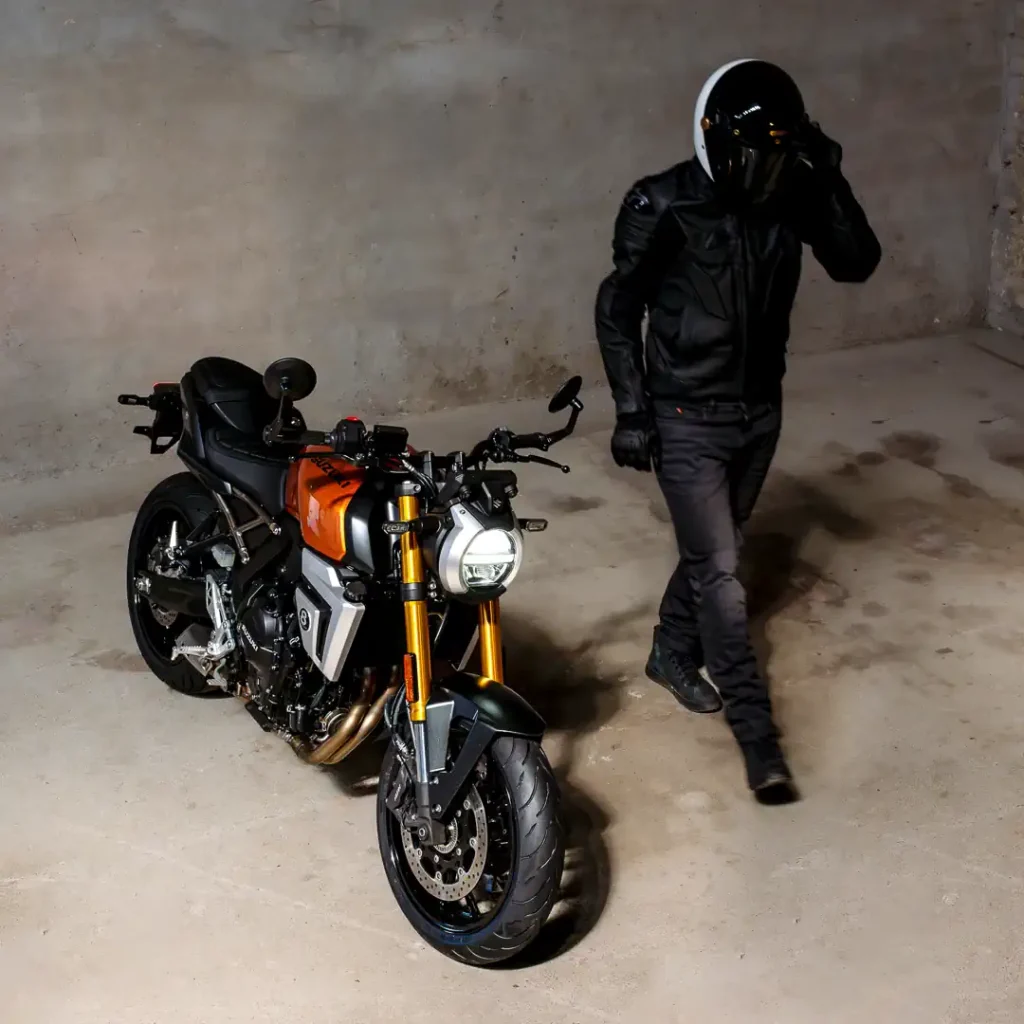 Suzuki GSX-8TT mounted with Continential ContiMotion tires, and a motorcycle rider stepping away