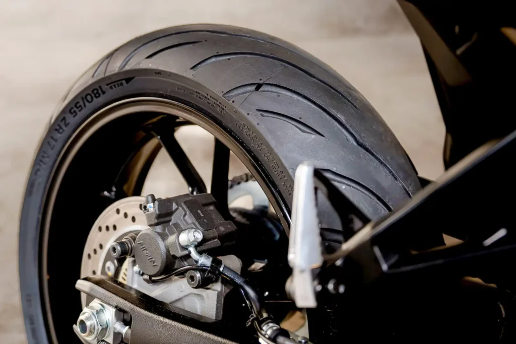 View of the back tire of a motorcycle with a Continental ContiMotion Evo tire mounted.