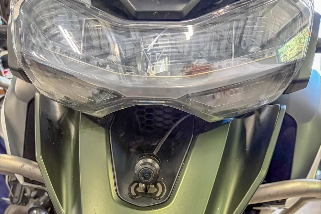 CPMC X6 camera installed on the front of an adventure bike