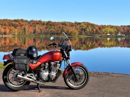 Fall Colors Motorcycle Ride: How to Catch the Peak A Yamaha Seca 750 parked in front of Sunday Lake in Michigan