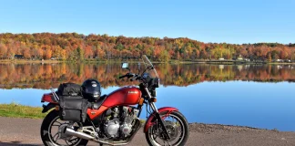 Fall Colors Motorcycle Ride: How to Catch the Peak A Yamaha Seca 750 parked in front of Sunday Lake in Michigan