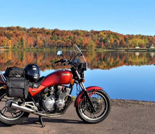 Fall Colors Motorcycle Ride: How to Catch the Peak A Yamaha Seca 750 parked in front of Sunday Lake in Michigan