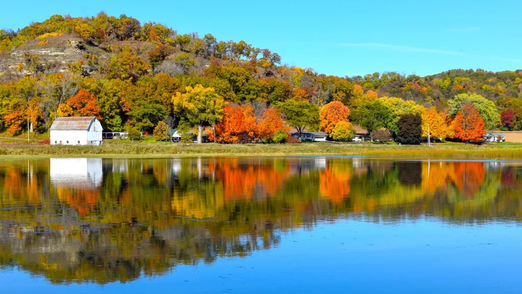 Fall colors in Wisconsin reflected on a Leland Millpond.
