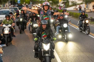 Italian Bike Week 2026 parade of motorcycles with an exuberant passenger