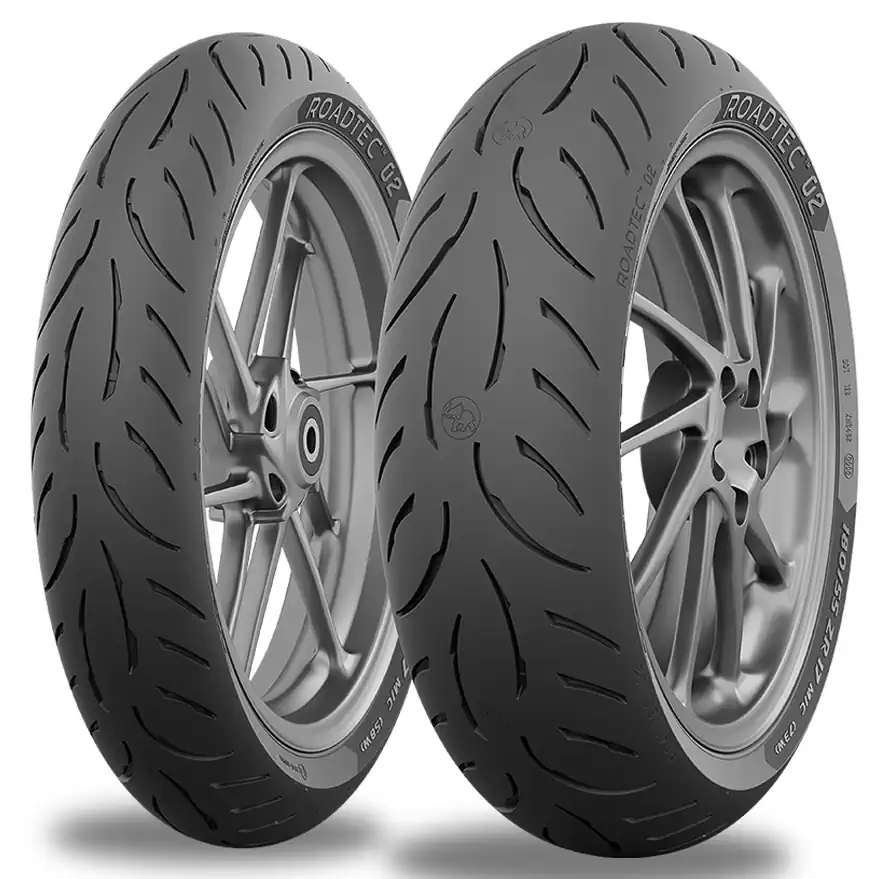 Stock photo of a 3/4 view of a pair of Metzeler Roadtec 02 tires