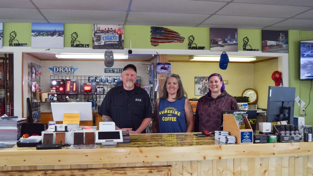 Three members of the Trails-North Powersports staff, including owner Matt Shinabery