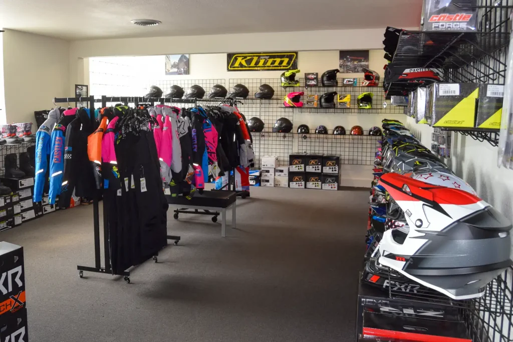 Motorcycle helmets and jackets on display for sale at Trails-North Powersports in Michigan