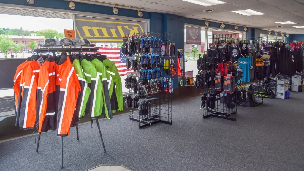 This is a room full of motorcycle riding gear for sale.