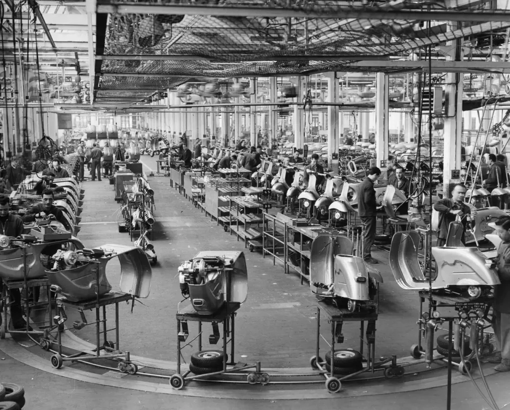 Vespa History: 1960s Vespa assembly line at the factory in Italy
