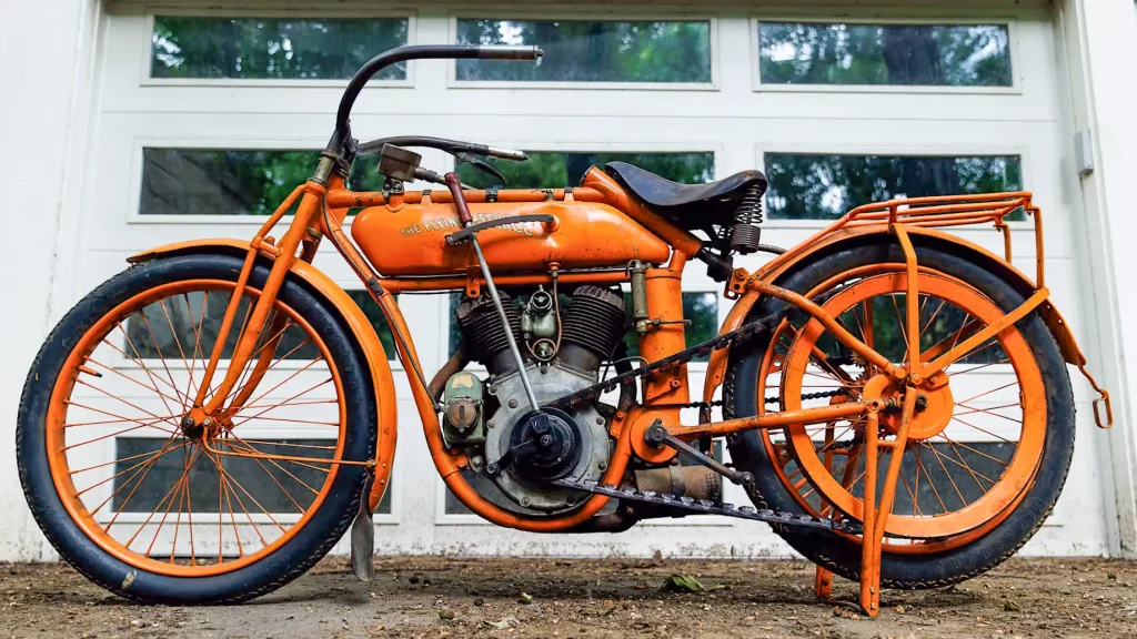 1914 Flying Merkel in front of garage door
