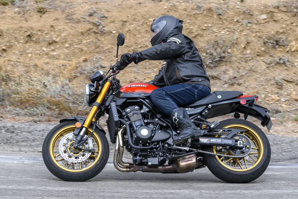 Left side profile of the Z900RS SE with the rider leaning over into the right hand turn.