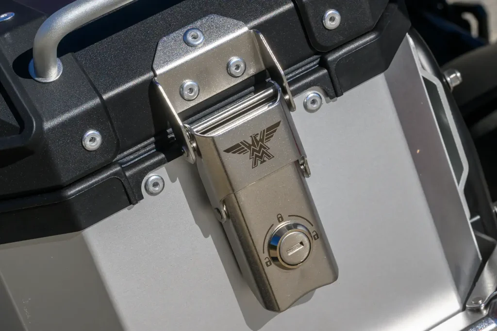 Aluminum motorcycle luggage latch with Moto Morini logo.