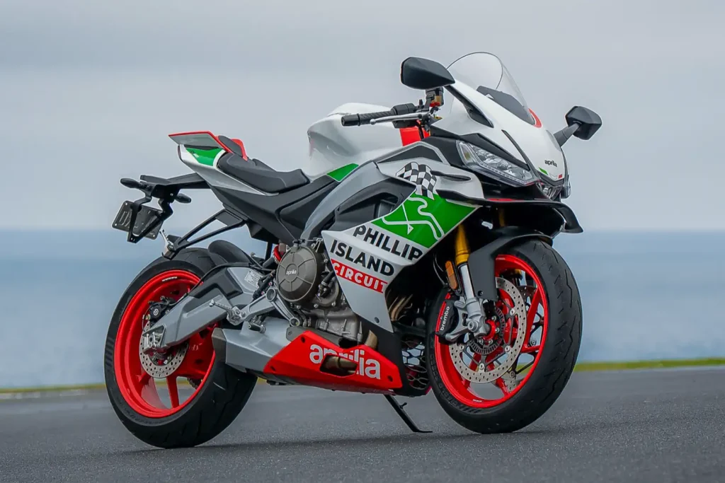 2027 Aprilia RS 660 Phillip Island Tribute model at the track with Bass Strait in the background.