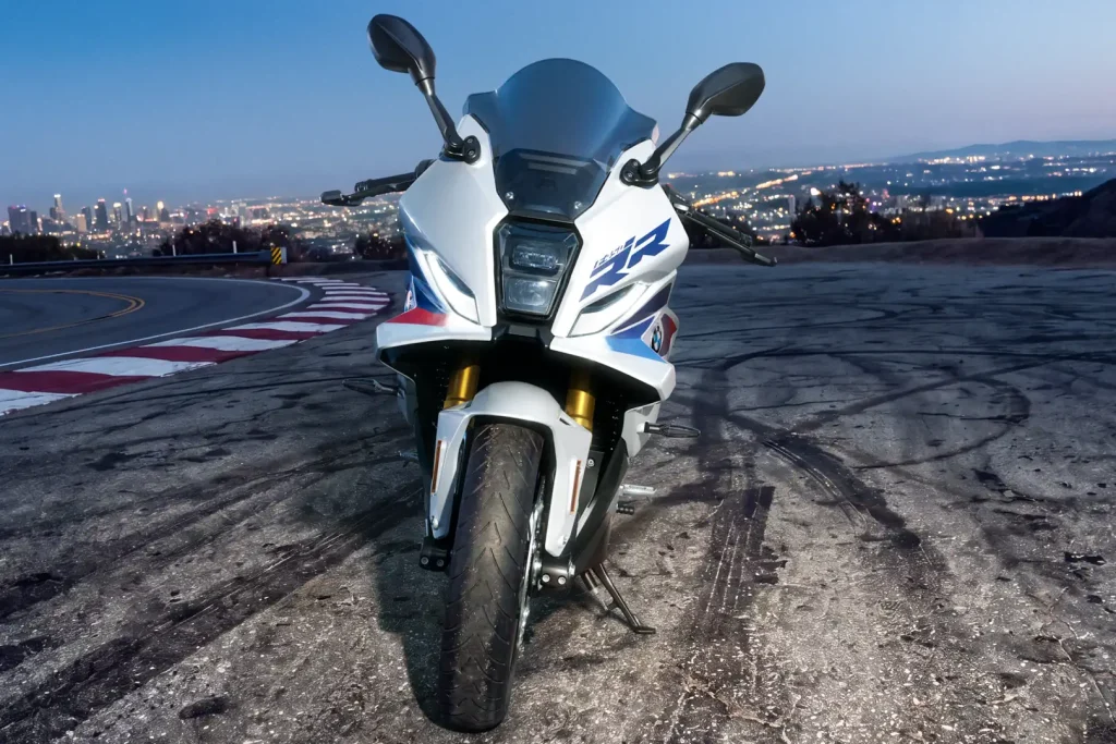 Front view of the 2027 BMW F 450 RR on the street with Los Angeles in the background