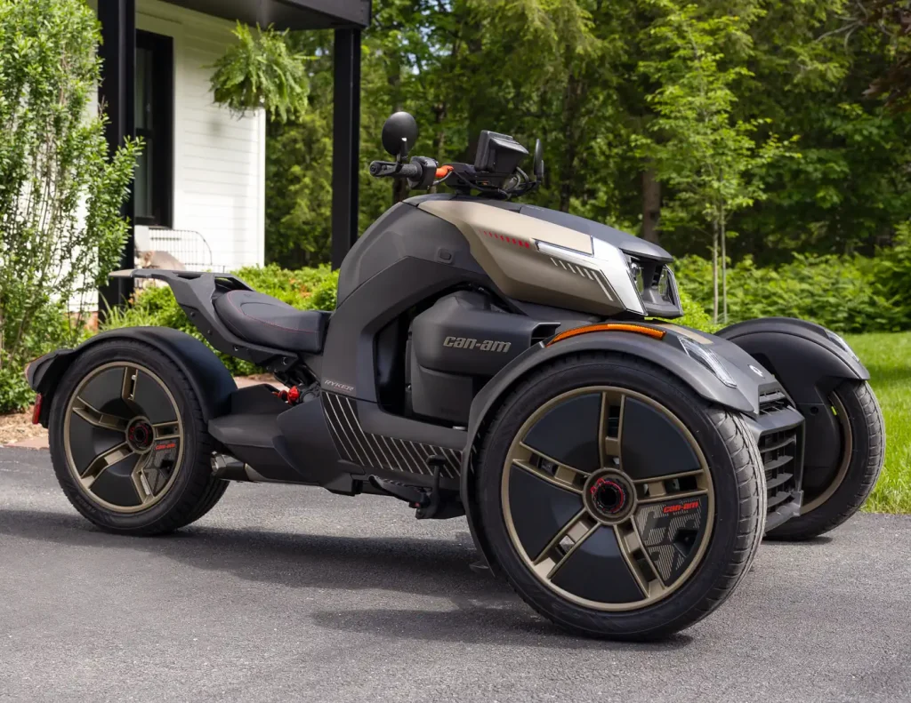 2027 Can-Am Ryker Special Series in the driveway of an affluent person's home.