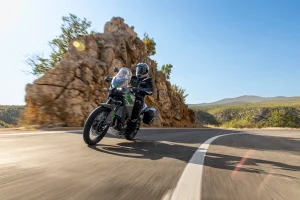 2027 Kawasaki KLE650 SE with a side case on a mountain road