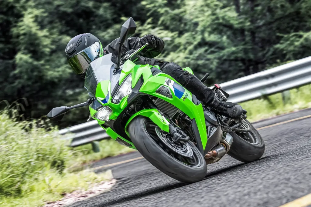 2027 Kawasaki Ninja 650 going around a right hand turn and leaned over.