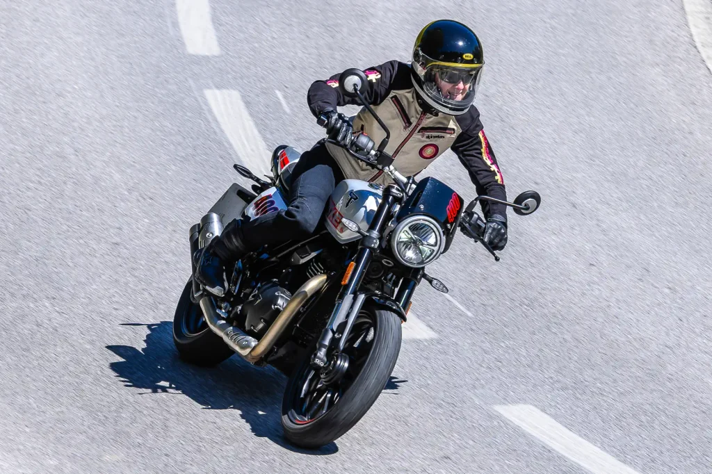2027 Triumph Tracker 400  leaned over in a left hand turn.