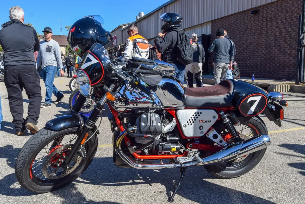 Left side of a Moto Guzzi V7 with a chrome gas tank.