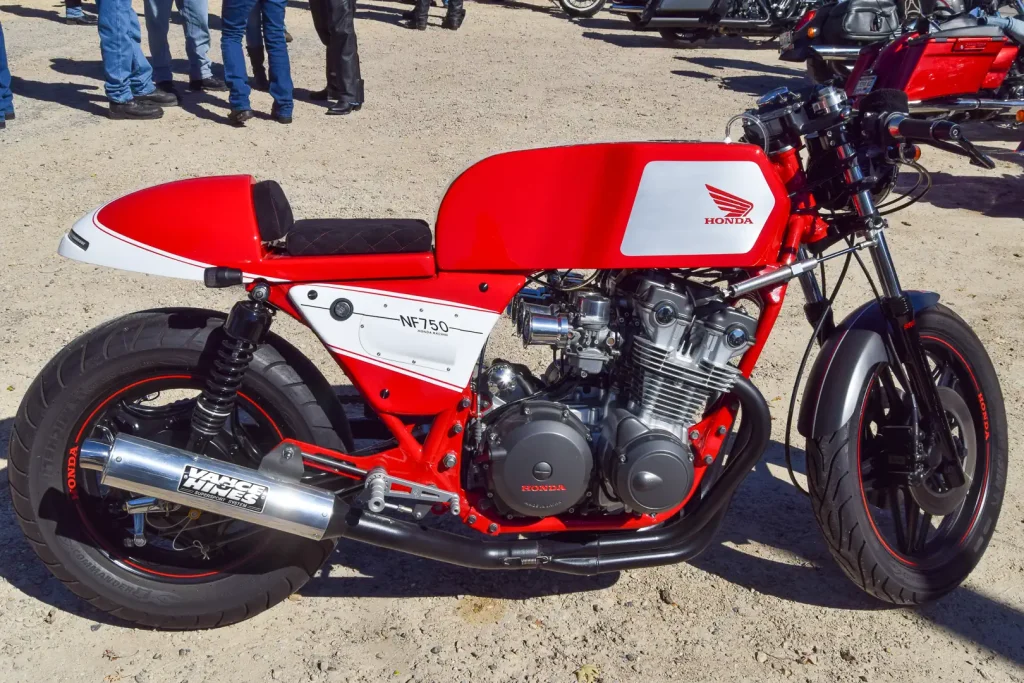 A custom Honda 750 Four dubbed the NF750, a red custom motorcycle.